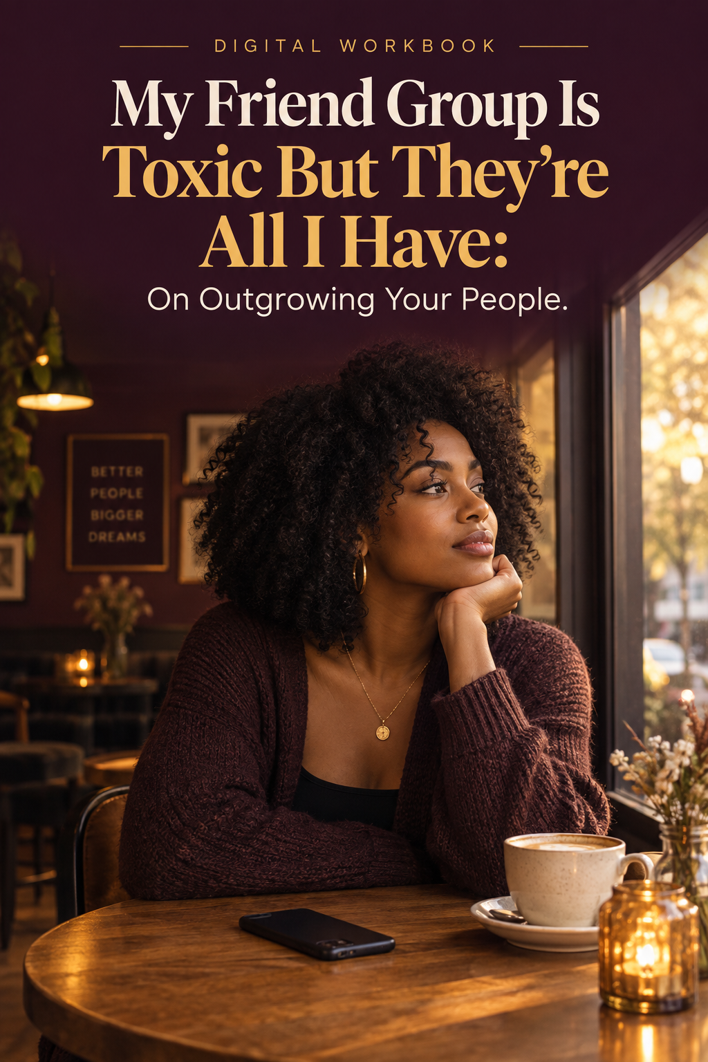 Young Black woman sitting alone at a café, phone face-down, looking out the window thoughtfully
